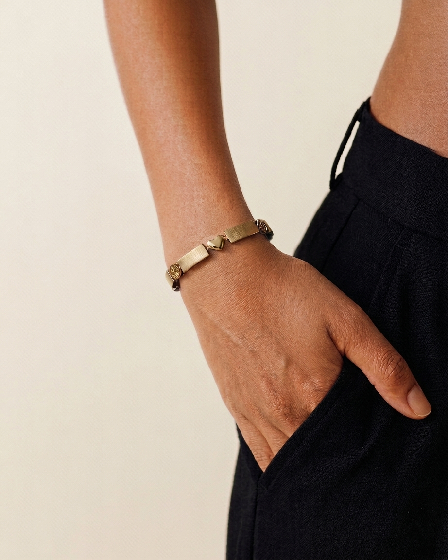Gold bracelet styled with a black outfit