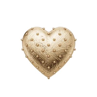 Gold heart-shaped decorative item with raised textures on a light gray background
